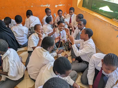 Students in Nakuru, Kenya build a device for the first international Tech Challenge held in 2023. More than 750 students participated in the inaugural program.