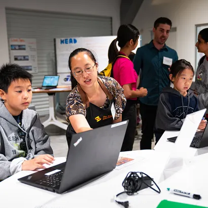 A Software Engineering Education Leader introducing a software engineering activity to students.