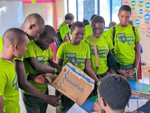 A team of students demonstrates their device to a panel of judges during the final showcase at The Tech Challenge Kenya 2025.