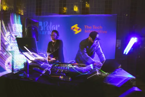 Two DJs spinning in The Tech Interactive